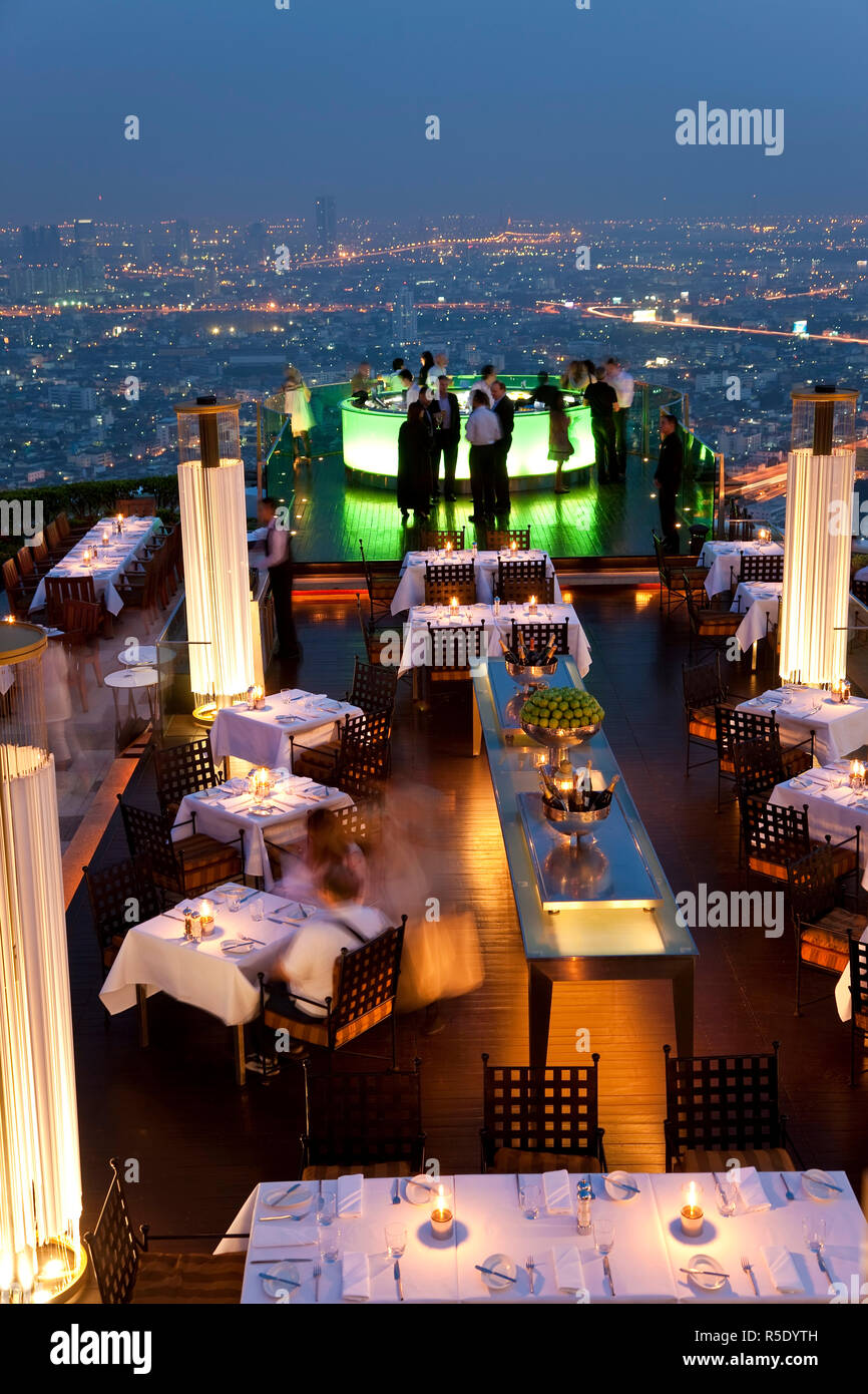Open air-bar 'Sirocco Sky Bar' and Bangkok in the evening, State Tower, 247 m, The Dome, Bangkok, Thailand Stock Photo