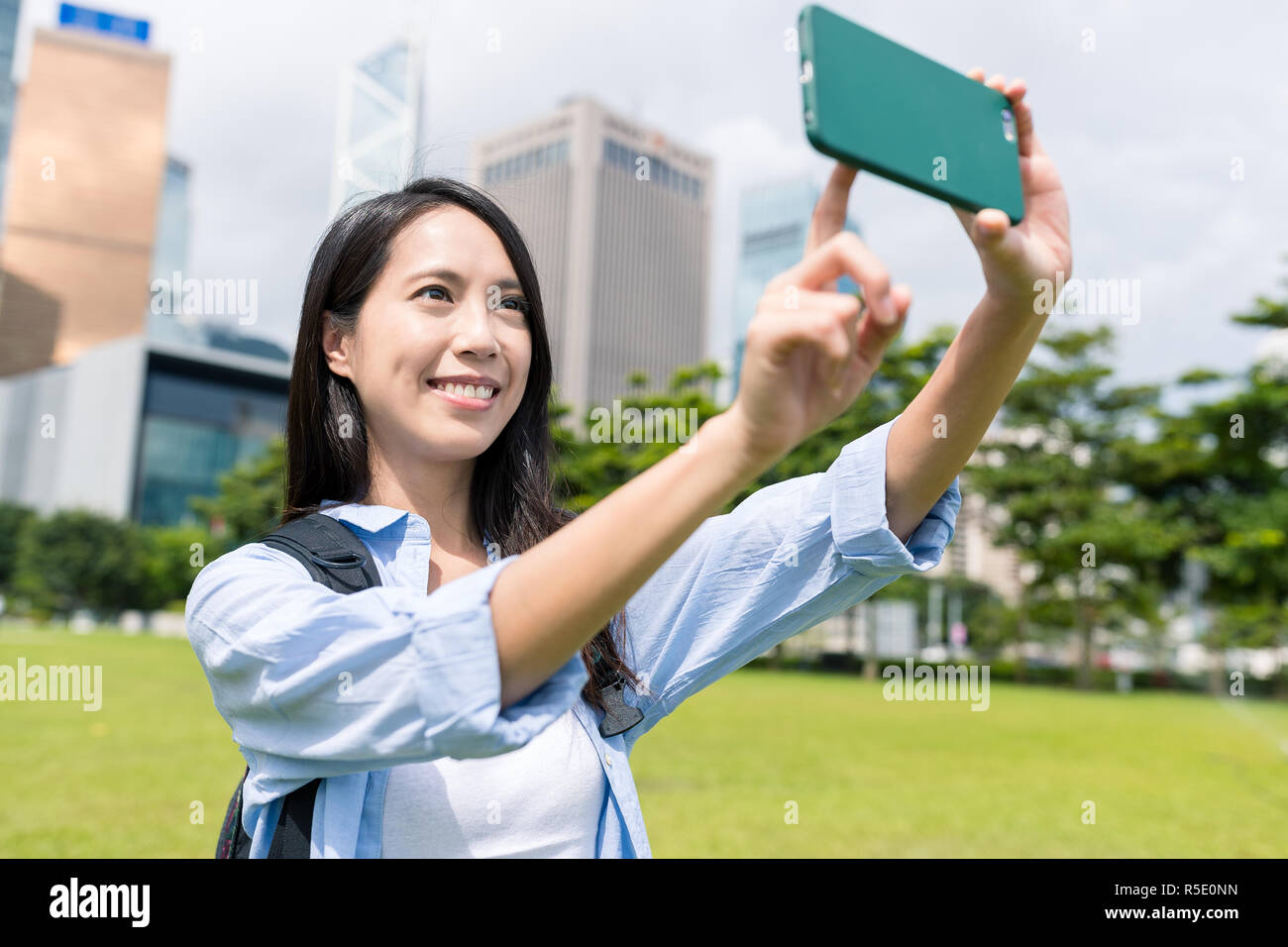 Woman travel in Hong Kong and taking selfie Stock Photo - Alamy