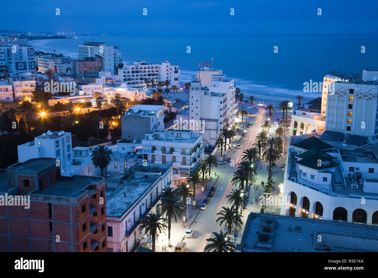 Tunisia, Tunisian Central Coast, Sousse, elevated view of Avenue Habib Bourguiba towards Boujaffar Beach, dusk Stock Photo