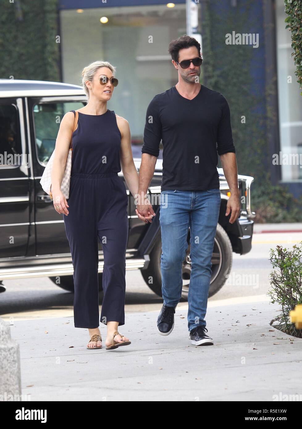 UFC host Caroline Pearce holds hands with her boyfriend Jason Shane Scott while out on a walk
