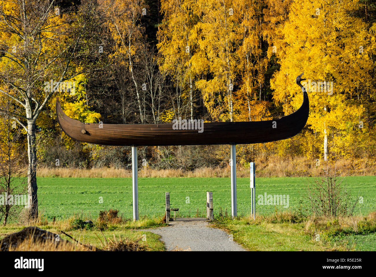 Barockparken autumn view and Viking longboat 'Åfare' artwork. Stora Wasby, Upplands Vasby or Upple Vasby town. Sweden. Stock Photo