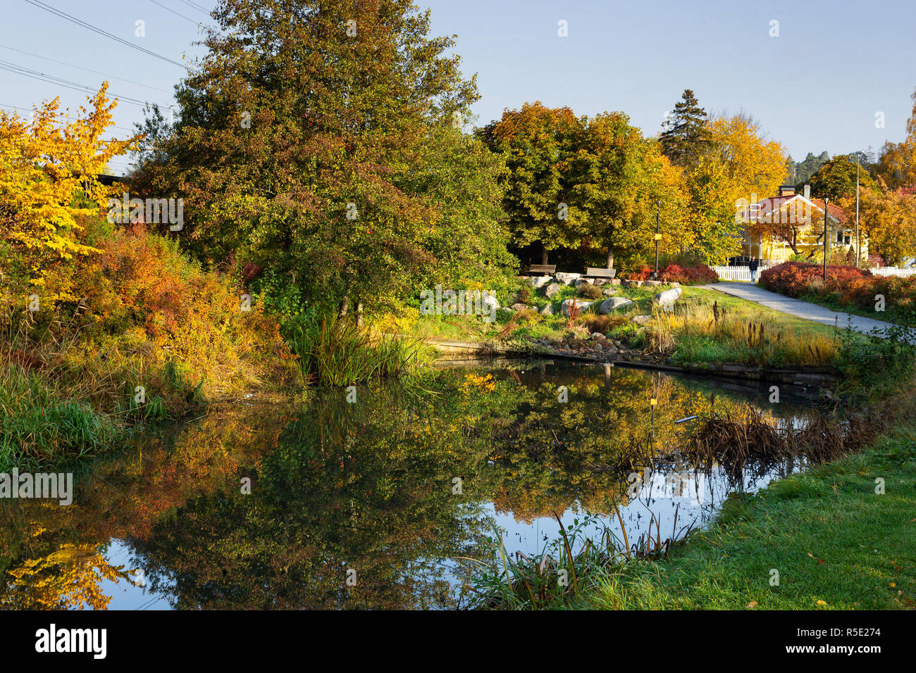 River side and fall season urban cityscape in central Upplands Vasby. Stockholm, Sweden. Stock Photo