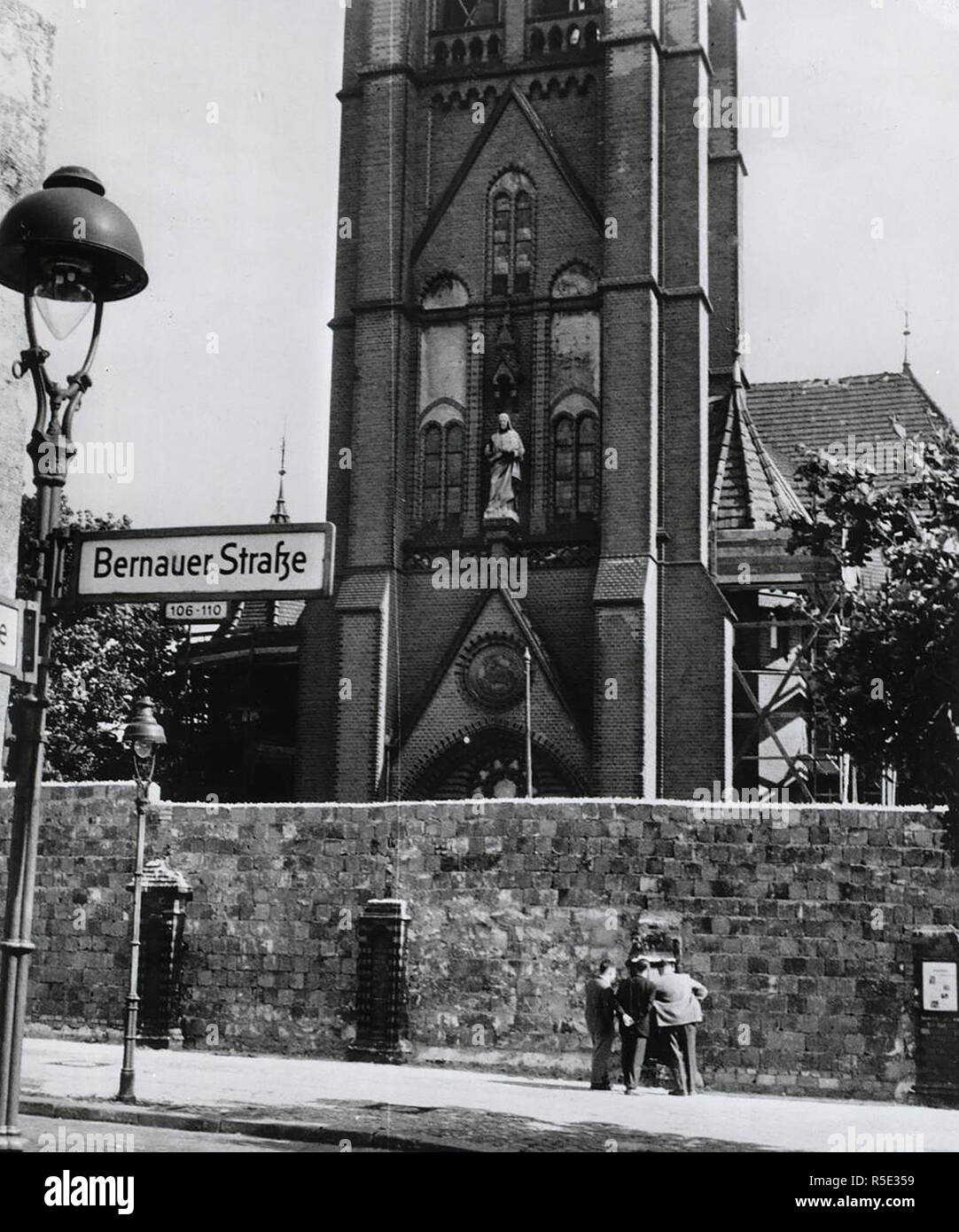 Berlin Wall along Bernauer Street blocks entrance to church in East Berlin symbolically reminding Germans of Communist opposition to religion. Stock Photo