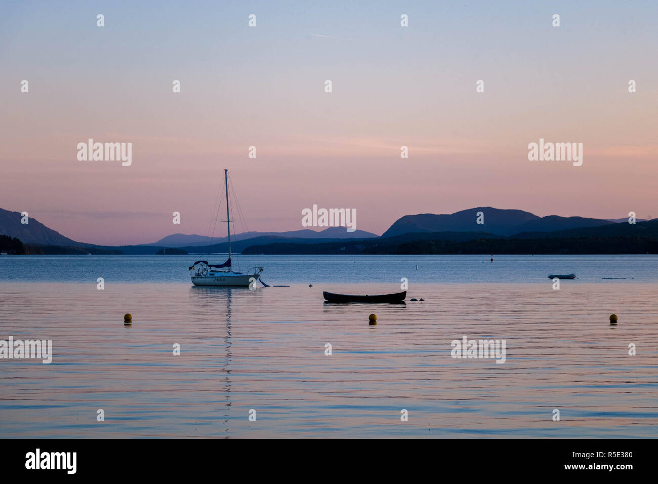 Two boats at the Magog Lake at sunset. The town of Magog, Quebec, Canada. Stock Photo