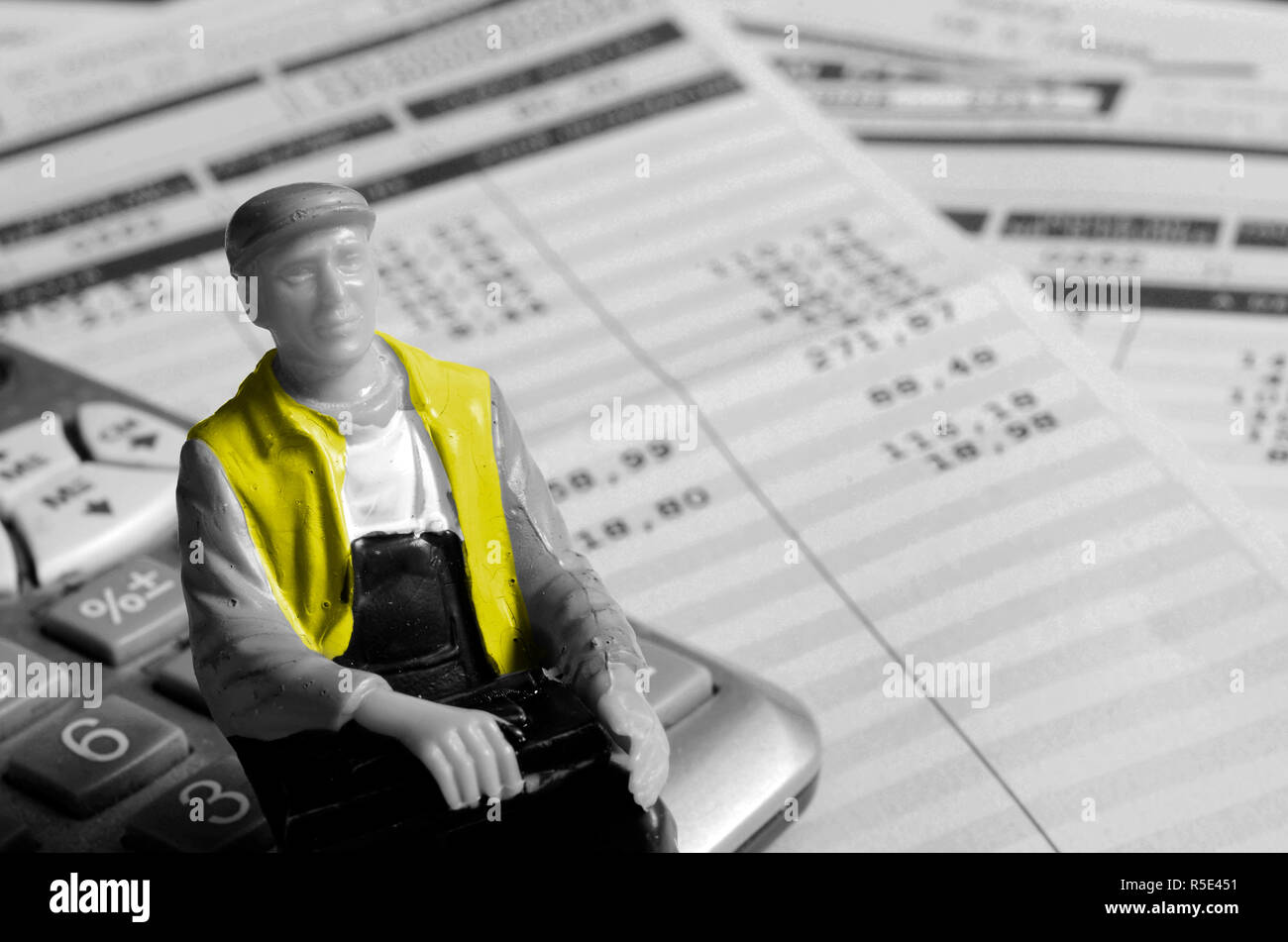 yellow vests man minitature on calculaotre, on pay sheets background, france  Stock Photo - Alamy