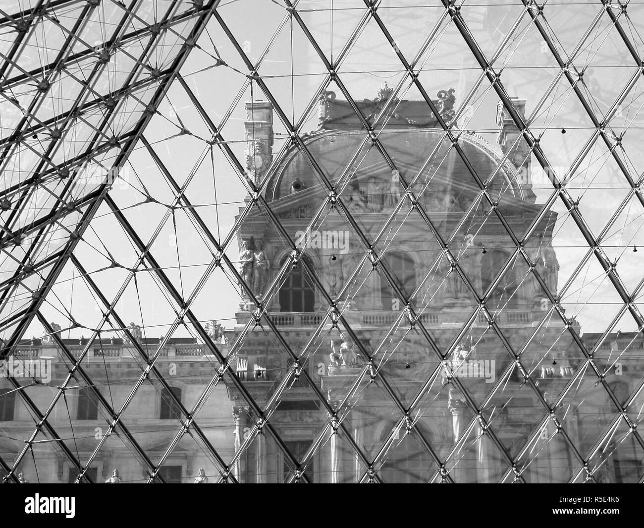 Pavillon Denon of the Palais du Louvre, Paris, France, seen from inside the Pyramid. Black and white version Stock Photo