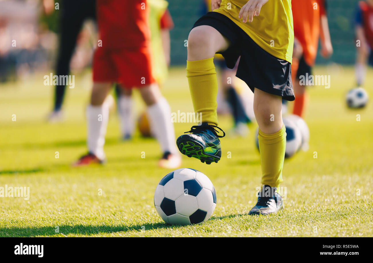 Soccer Football Training for Children. Kids Playing Soccer on Training  Football Pitch. Beginner Soccer Drills for Kids. Coach in the Background  Coachi Stock Photo - Alamy