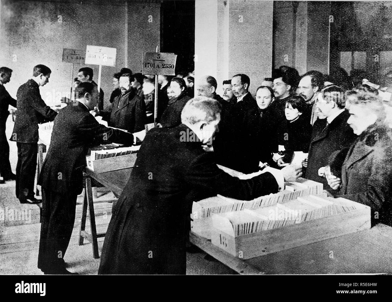 Food Administration - Anti-Waste Campaign - Americans save food to aid Belgium. Issuing food tickets in Brussels ca. 1917-1919 Stock Photo