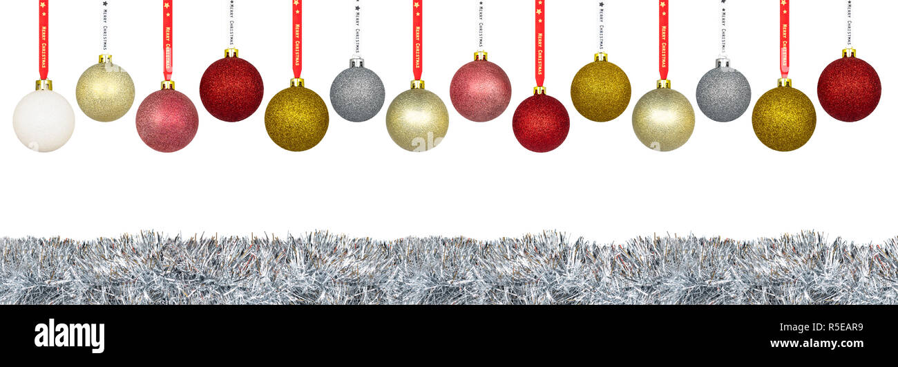 A lot of colorful Christmas baubles hanging on a ribbon over a silver  tinsel, isolated on a white background with a clipping path and copy space  Stock Photo - Alamy