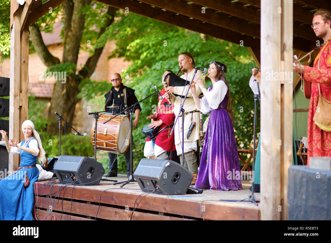TRAKAI, LITHUANIA - JUNE 16, 2018: Historical reenactment activists playing folk-rock music during annual Medieval Festival, held in Trakai Peninsular Stock Photo