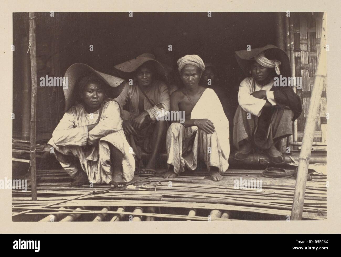 A group of Shans, taken at Bhamo. These tribes inhabit the mountainous country to the east of Upper Burmah. 'Burmah. A series of one hundred photographs illustrating incidents connected with the British Expeditionary Force to that country, from the embarkation at Madras, 1st Nov, 1885, to the capture of King Theebaw...'. 1886. Photograph. Source: Photo 312/(97). Author: Willoughby Wallace Hooper. Stock Photo