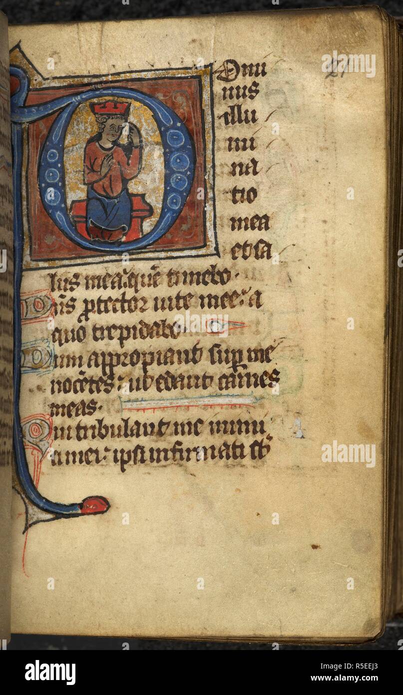 Historiated initial 'D'(ominus) with King David pointing at his eyes at ...