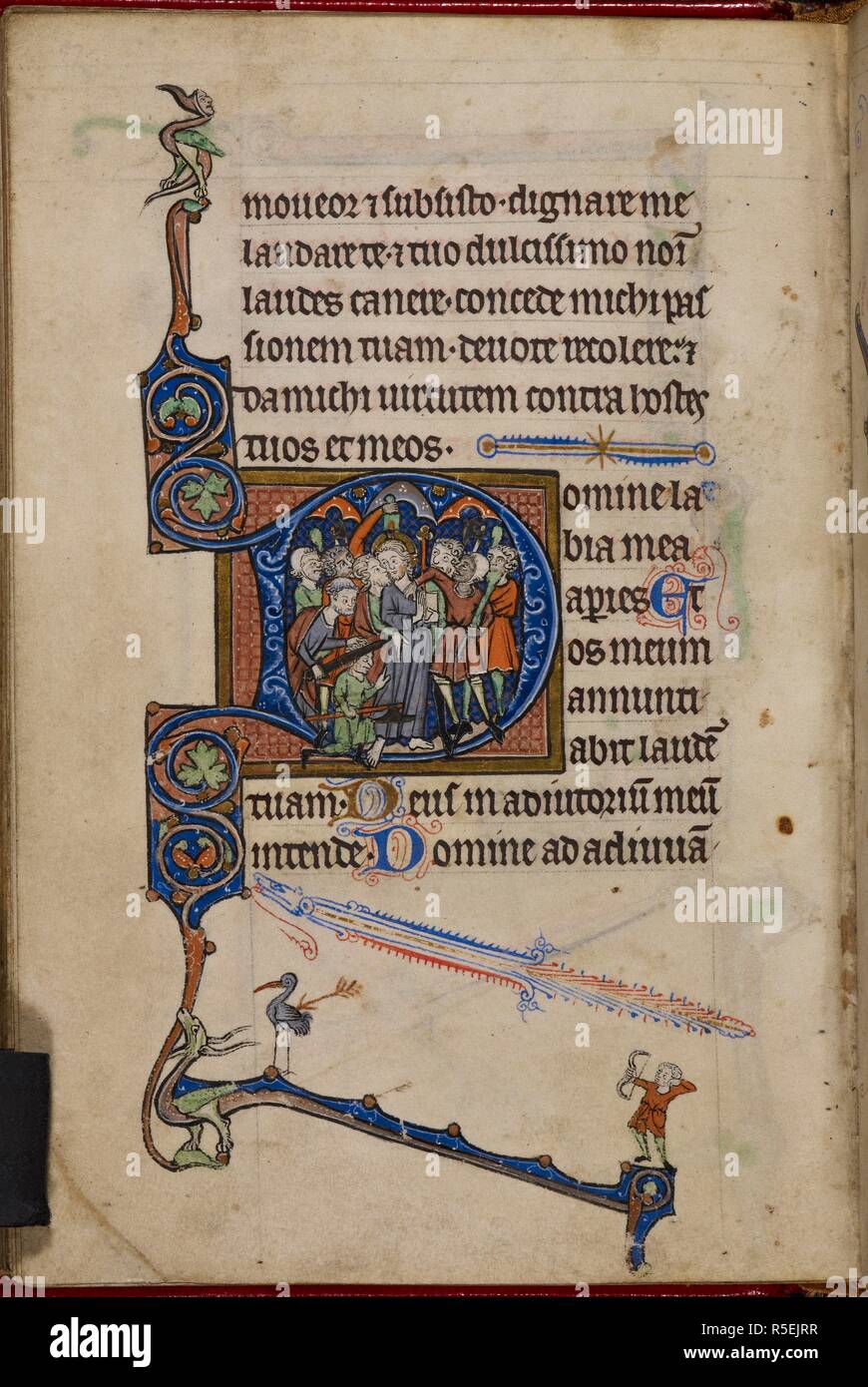 Historiated initial 'D'(omine) of the Betrayal of Christ, at the beginning of Matins in the Office of the Passion. Judas kisses Jesus, who holds a staff and book and is surrounded by soldiers holding clubs and axes. To the left, Peter cuts the ear of a crouching soldier with a large sword. In the lower bar border, is a dragon and a man shooting an arrow at a bird. Book of Hours. England, S. or Central (Oxford or West Midlands?); 3rd quarter of the 13th century. Source: Egerton 1151, f.95v. Language: Latin, some rubrics in French. Stock Photo