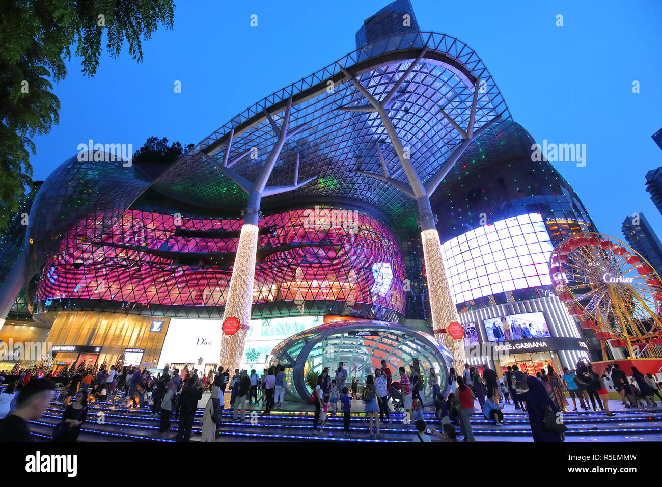 People visit ION Orchard shopping mall in Orchard road Singapore Stock