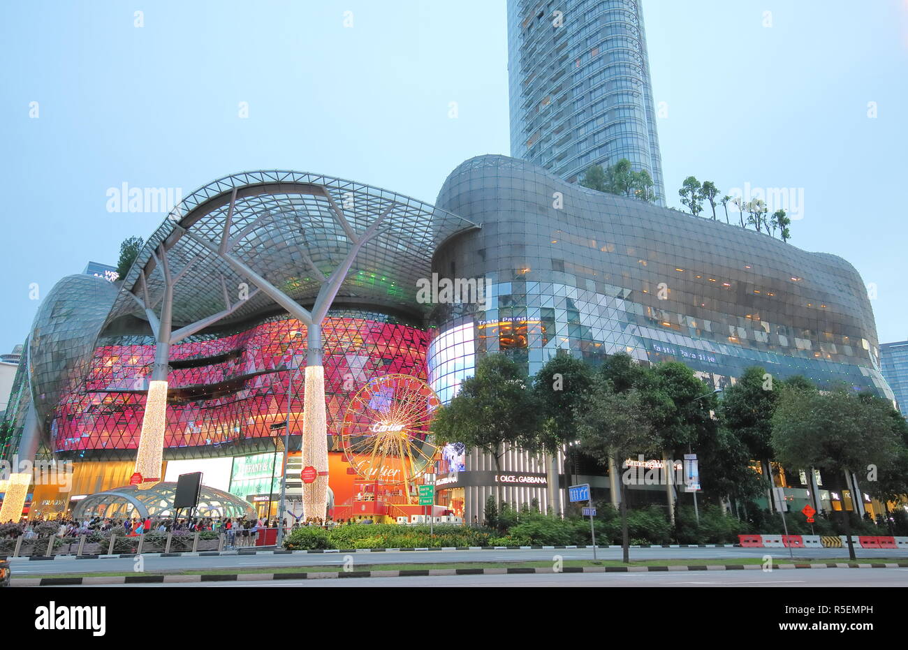 People visit ION Orchard shopping mall in Orchard road Singapore Stock
