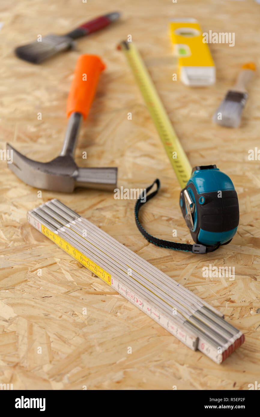 Variety of carpentry tools on wooden work surface. Stock photo Stock ...