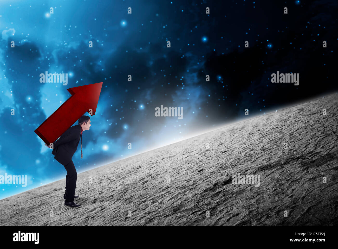Asian business man carry big red arrow on his back Stock Photo - Alamy