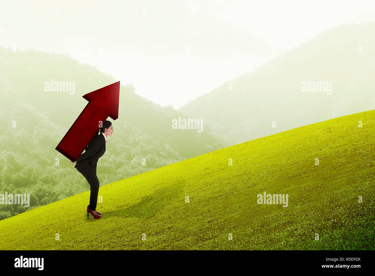Asian business woman carry big red arrow on her back Stock Photo - Alamy