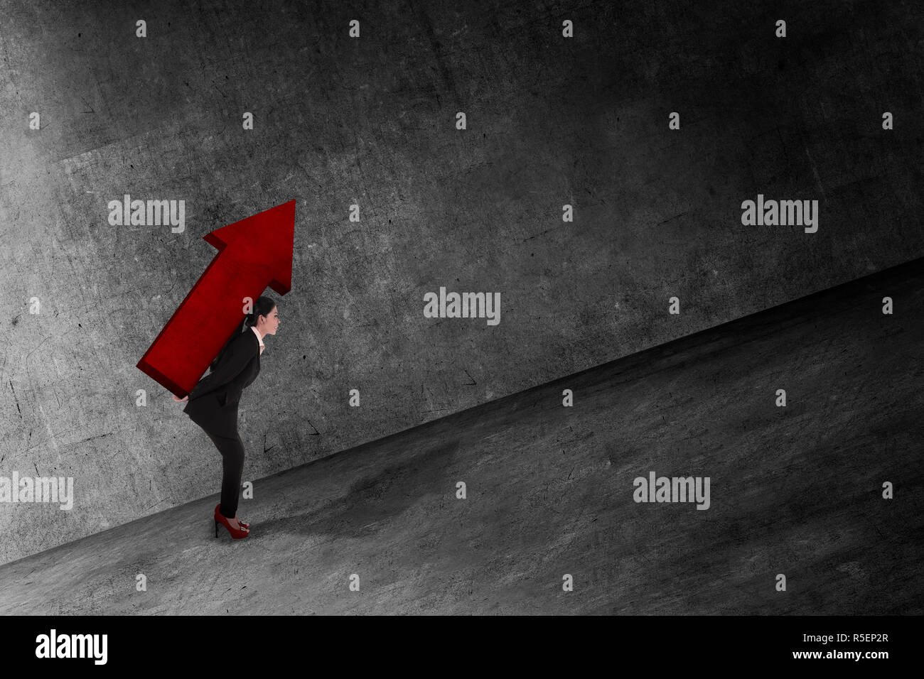 Asian business woman carry big red arrow on her back Stock Photo - Alamy
