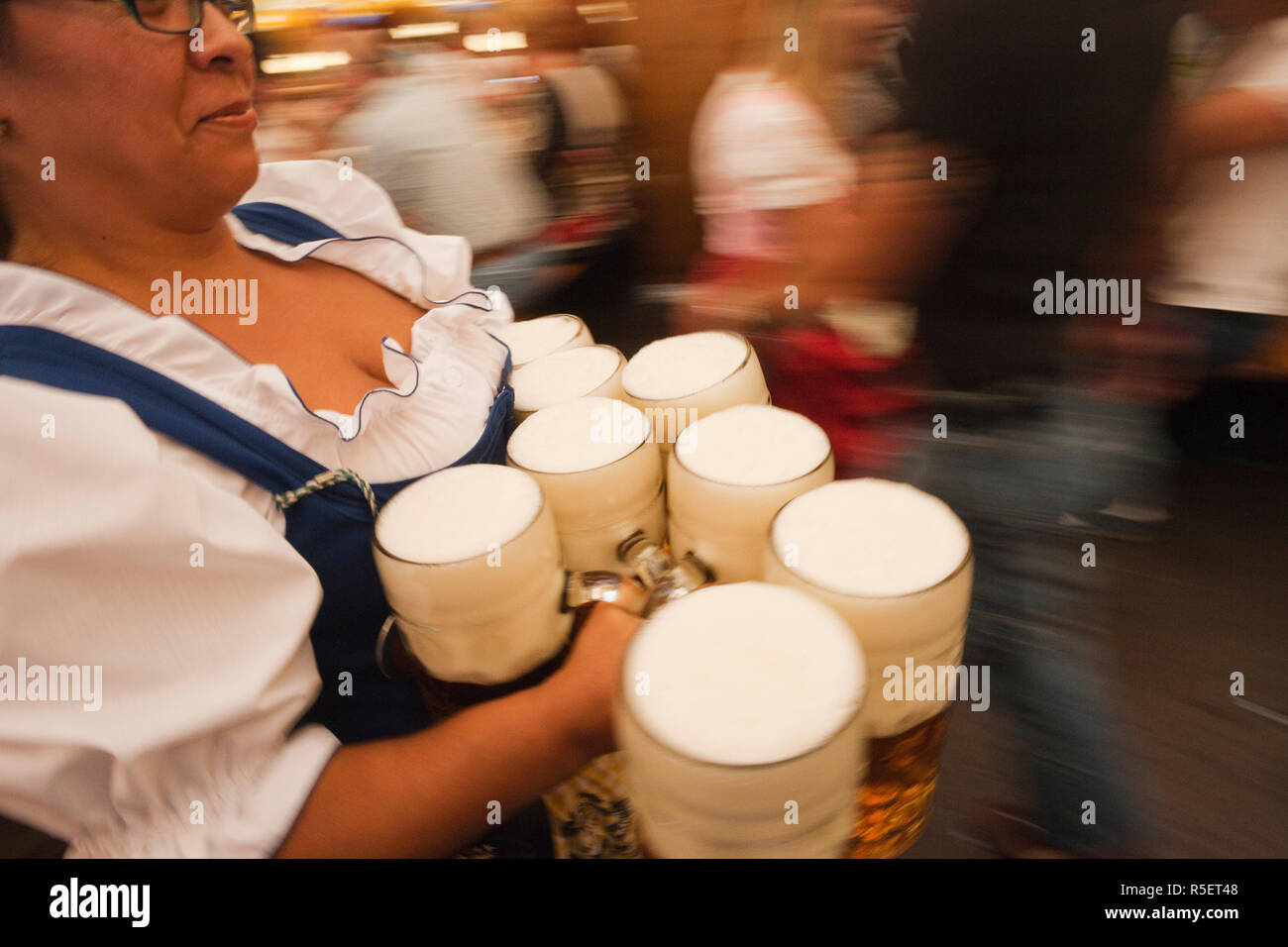 Germany, Bavaria, Munich, Oktoberfest, Waitress with Beer Steins Stock Photo