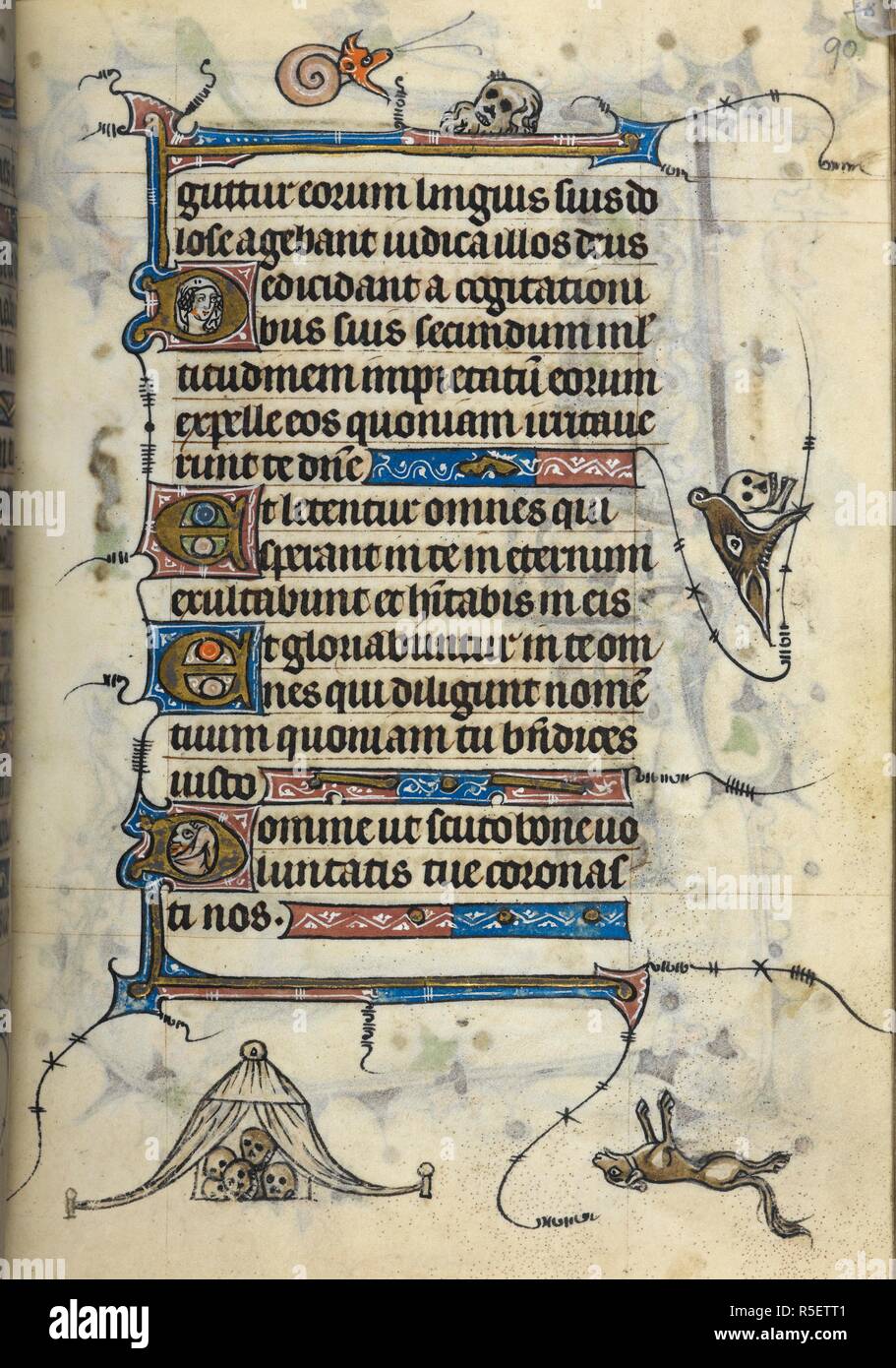A marginal illustration of a dog laying on its back next to a tent of skulls. Book of Hours (fragmentary), Use of St Omer, with prayers in French. France, N. (Saint-Omer or Therouanne); 1318-1330. Source: Add. 36684, f.90. Language: Latin and French. Stock Photo