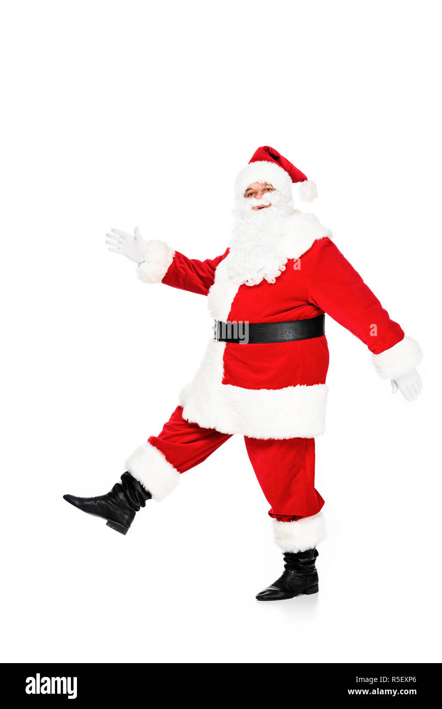 side view of santa claus walking and looking at camera isolated on white Stock Photo