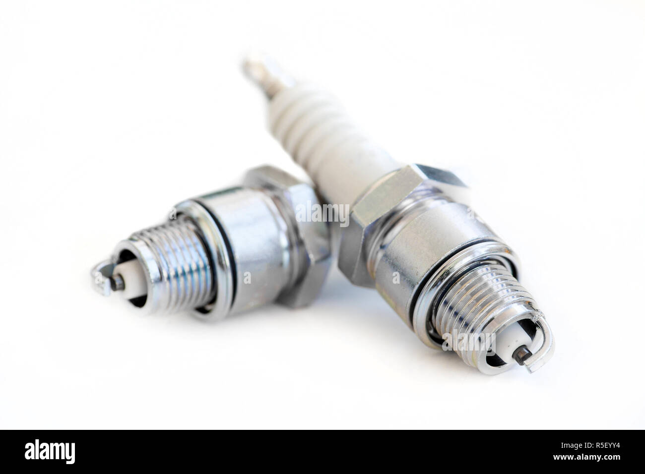 Two spark plugs on white Stock Photo Alamy