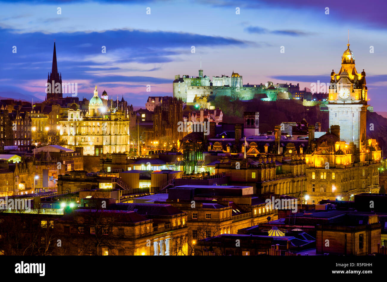 UK, Scotland, Edinburgh, Edinburgh Castle and tower of Balmoral Hotel Stock Photo