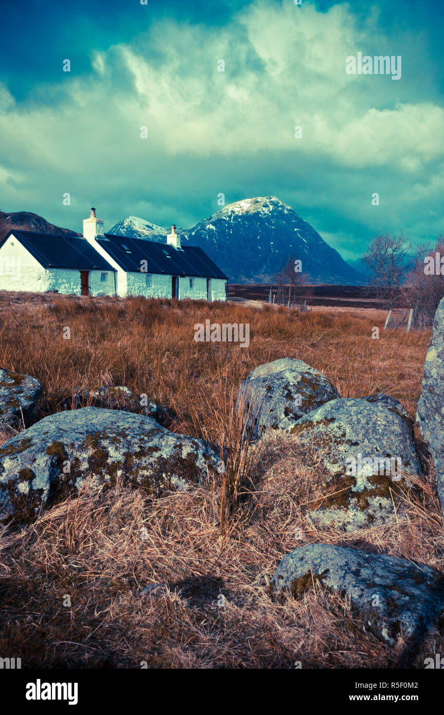 UK, Scotland, Highland, Glen Coe, Black Rock Cottage with Buachaille Etive Mor beyond Stock Photo