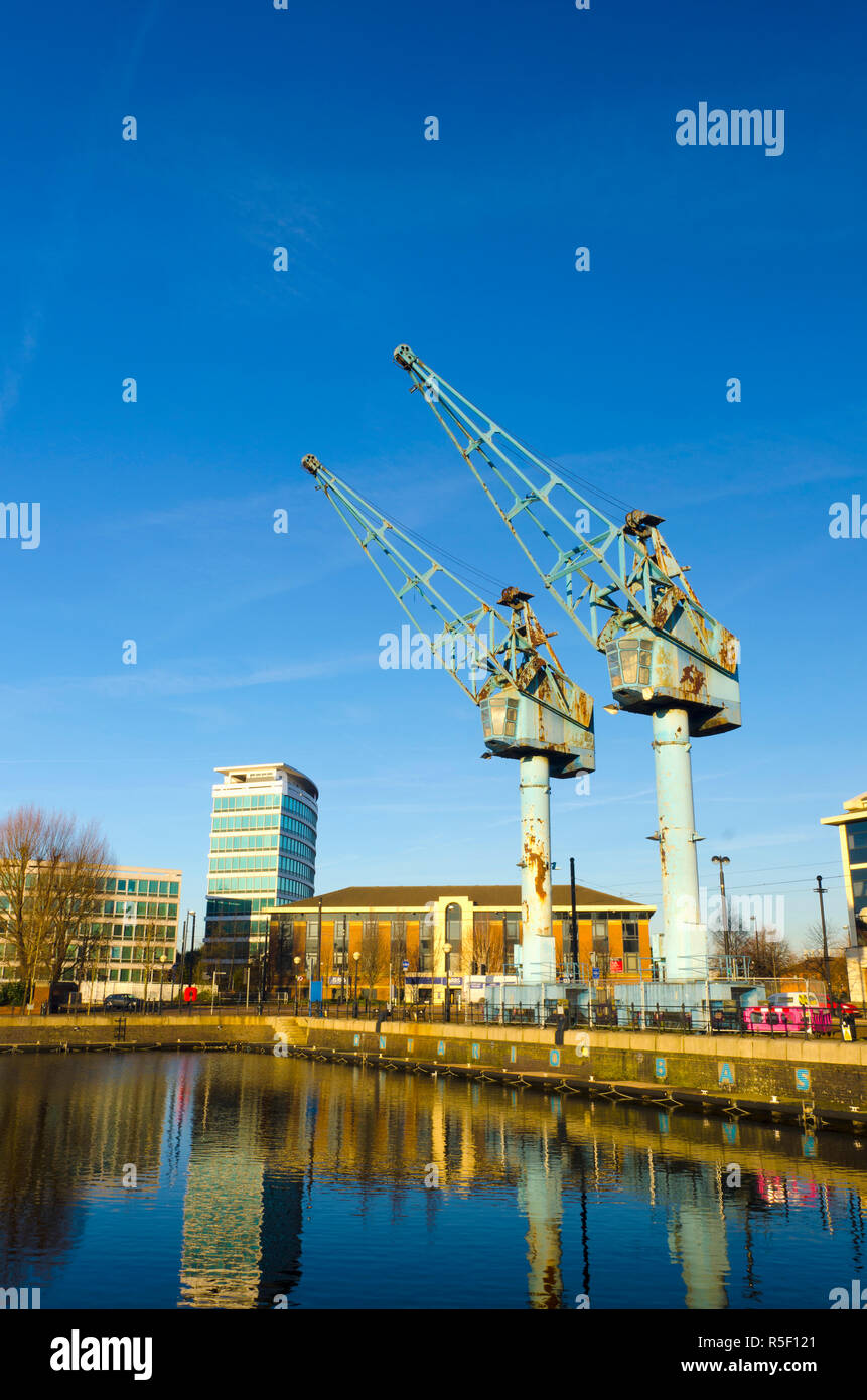 UK, England, Greater Manchester, Salford, Salford Quays, Ontario Basin, disused dock cranes Stock Photo