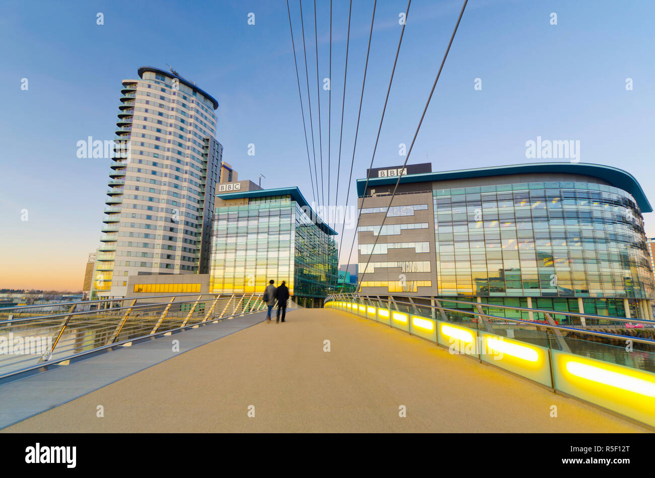UK, England, Greater Manchester, Salford, Salford Quays, North Bay, MediaCityUK, housing BBC, and MediaCityUK Footbridge Stock Photo