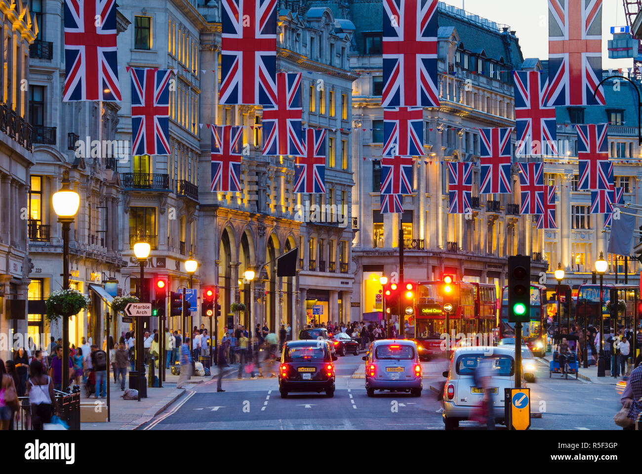 UK, England, London, Regent Street, Taxis and Union Jack Flags Stock Photo