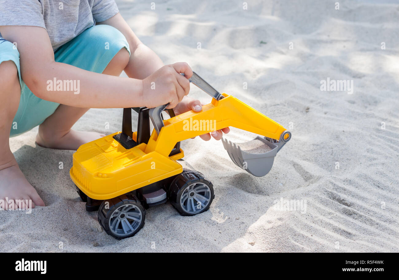 little boy playing with toy excavator Stock Photo Alamy