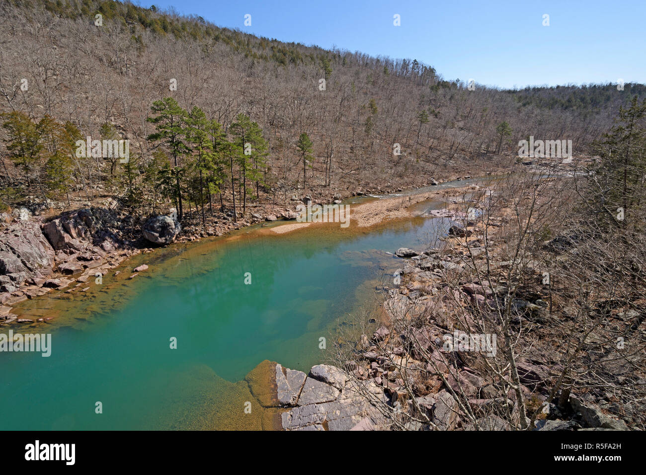 Aqua Colored Pond in a Wilderness Stream Stock Photo