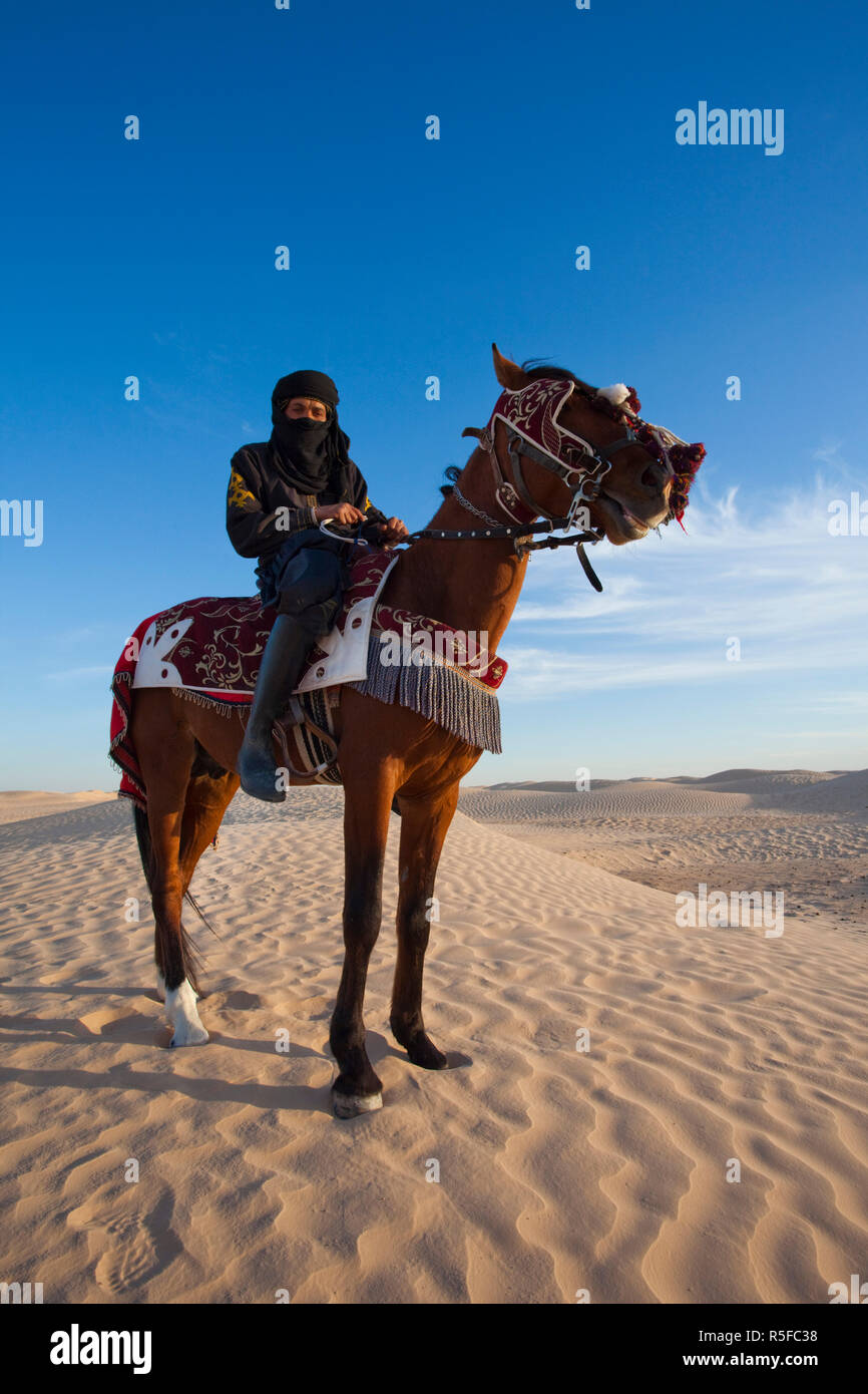 Tunisia, Sahara Desert, Douz, Great Dune, rider and horse, NR Stock Photo