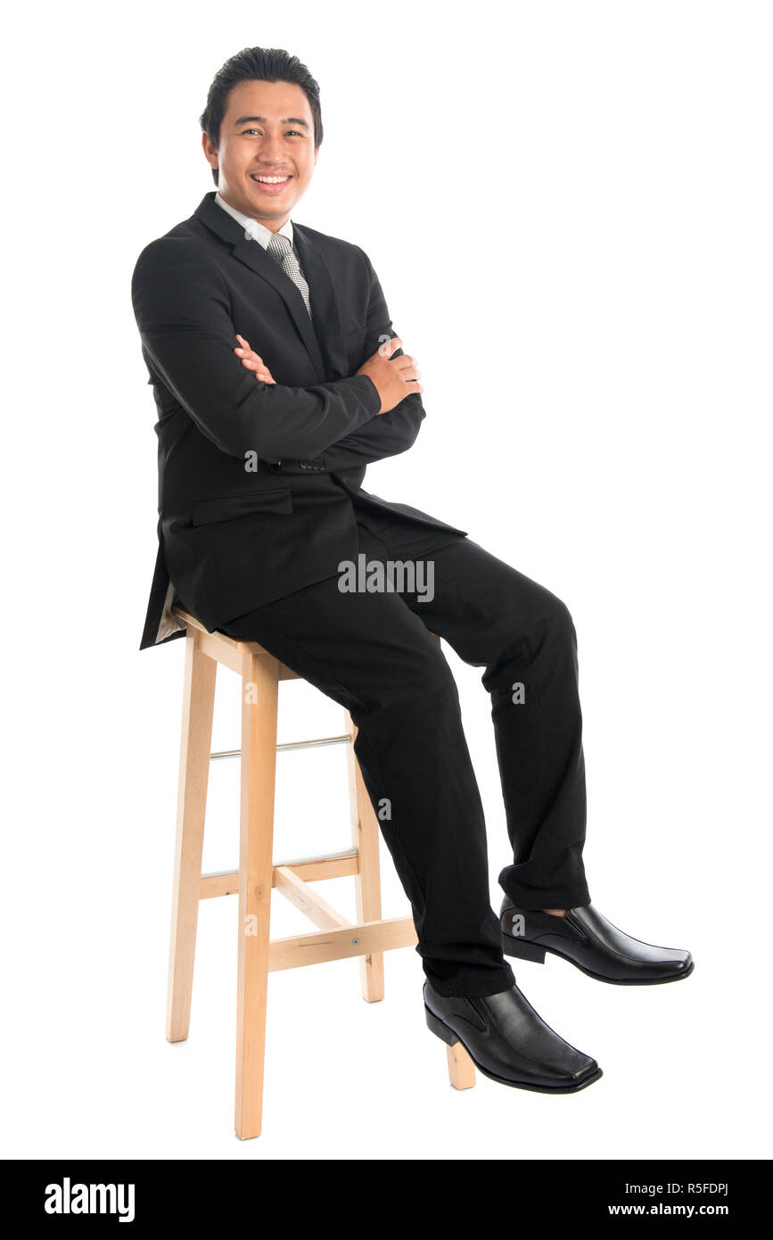 Full body Asian businessman arm crossed sitting on chair Stock Photo ...