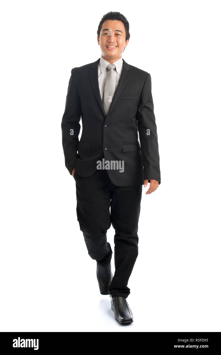 Full body Asian businessman walking Stock Photo - Alamy