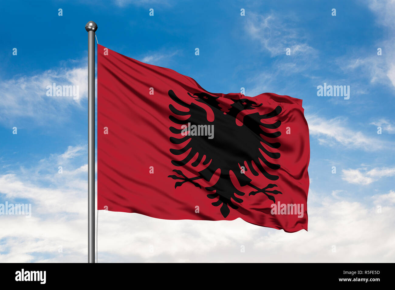 Flag of Albania waving in the wind against white cloudy blue sky Stock ...