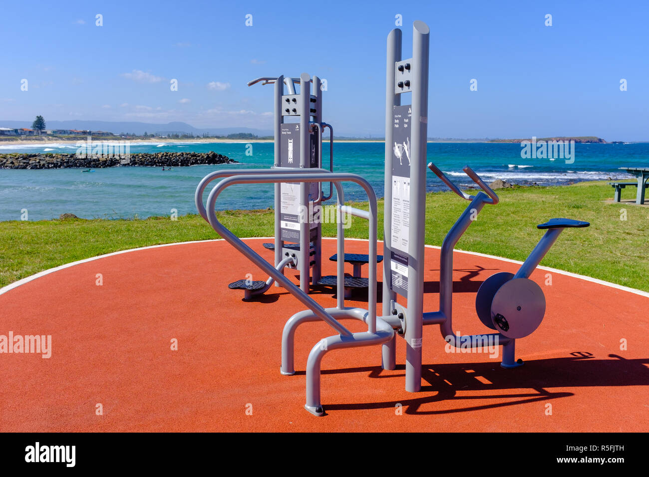 Fighting obesity, outside public exercise equipment, near beach by the local council to encourage people to stay healthy, lose weight and keep fit Stock Photo