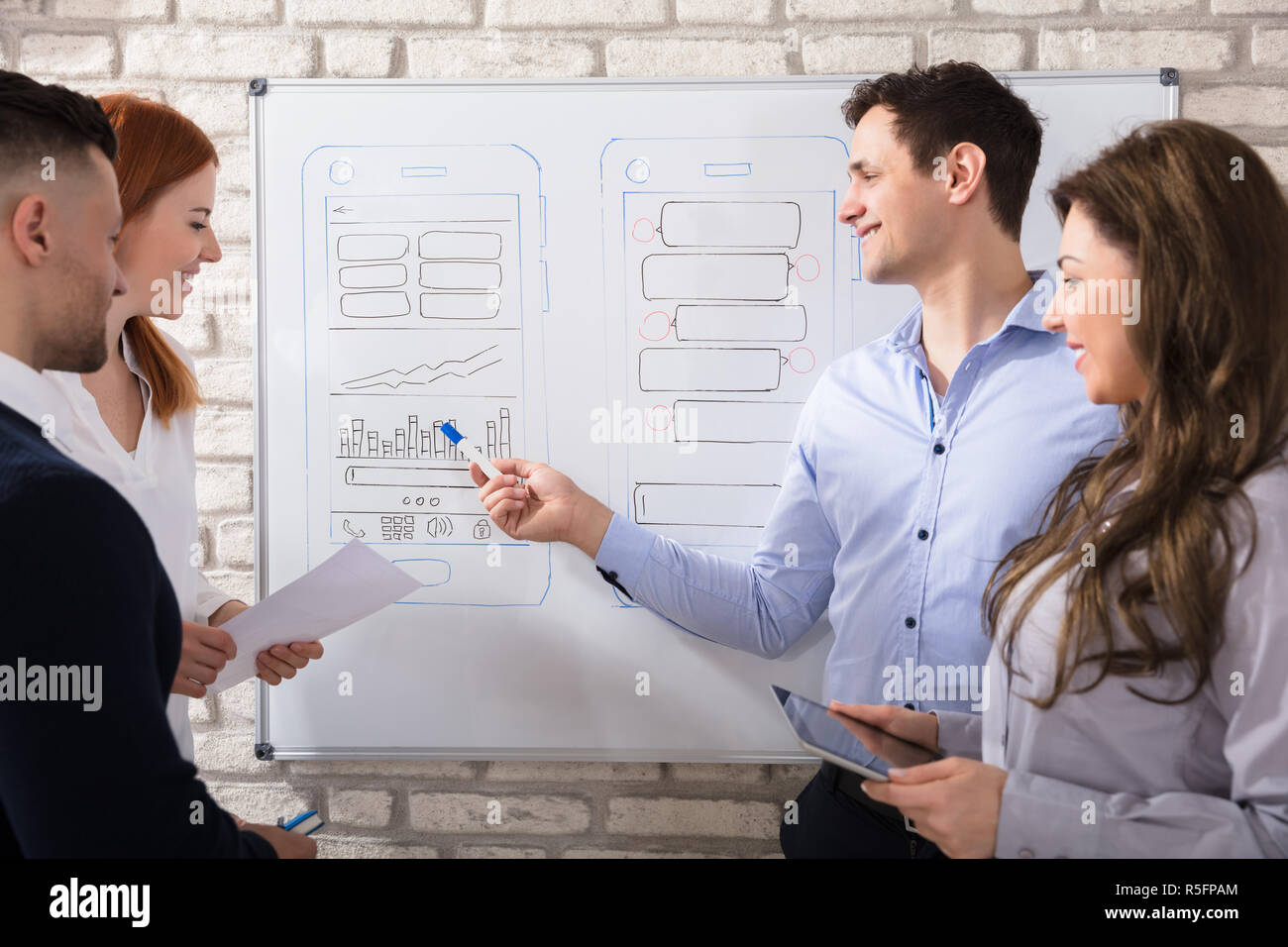 Designer Working At New Mobile Applications Stock Photo