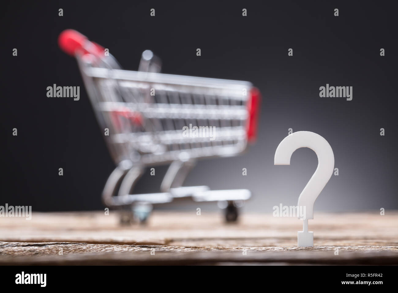 Question Mark With Shopping Cart In Background Stock Photo Alamy