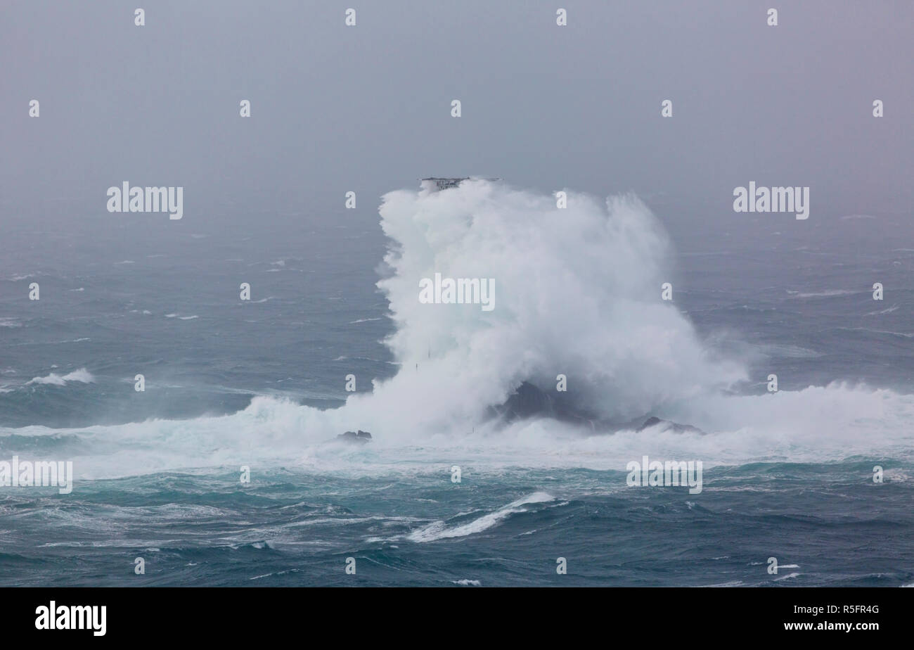 Storm Diana off the coast of Cornwall crashing into the Longships Lighthouse Stock Photo