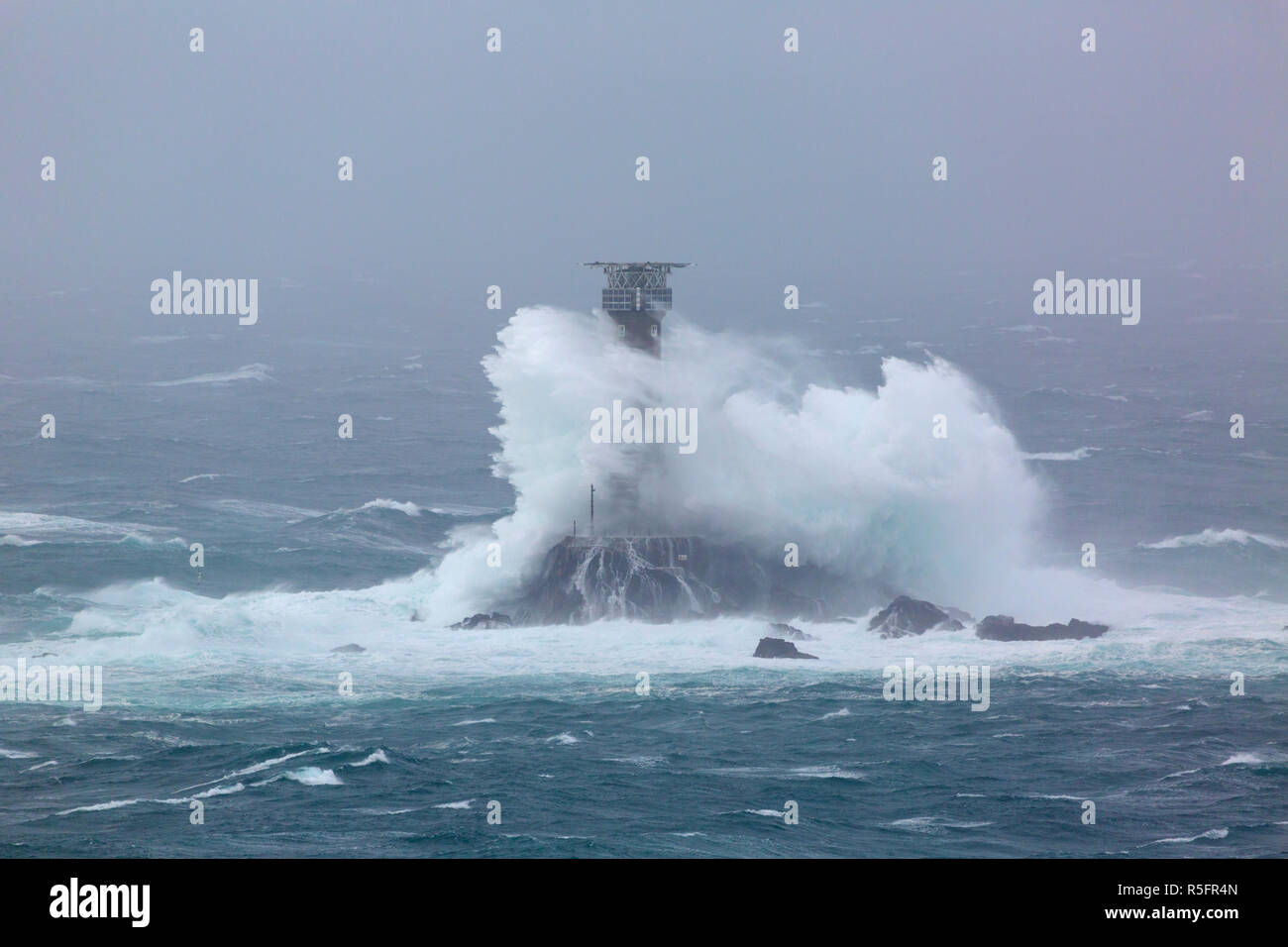 Storm Diana smashing into the Longships Lighthouse off the coast of Cornwall Stock Photo