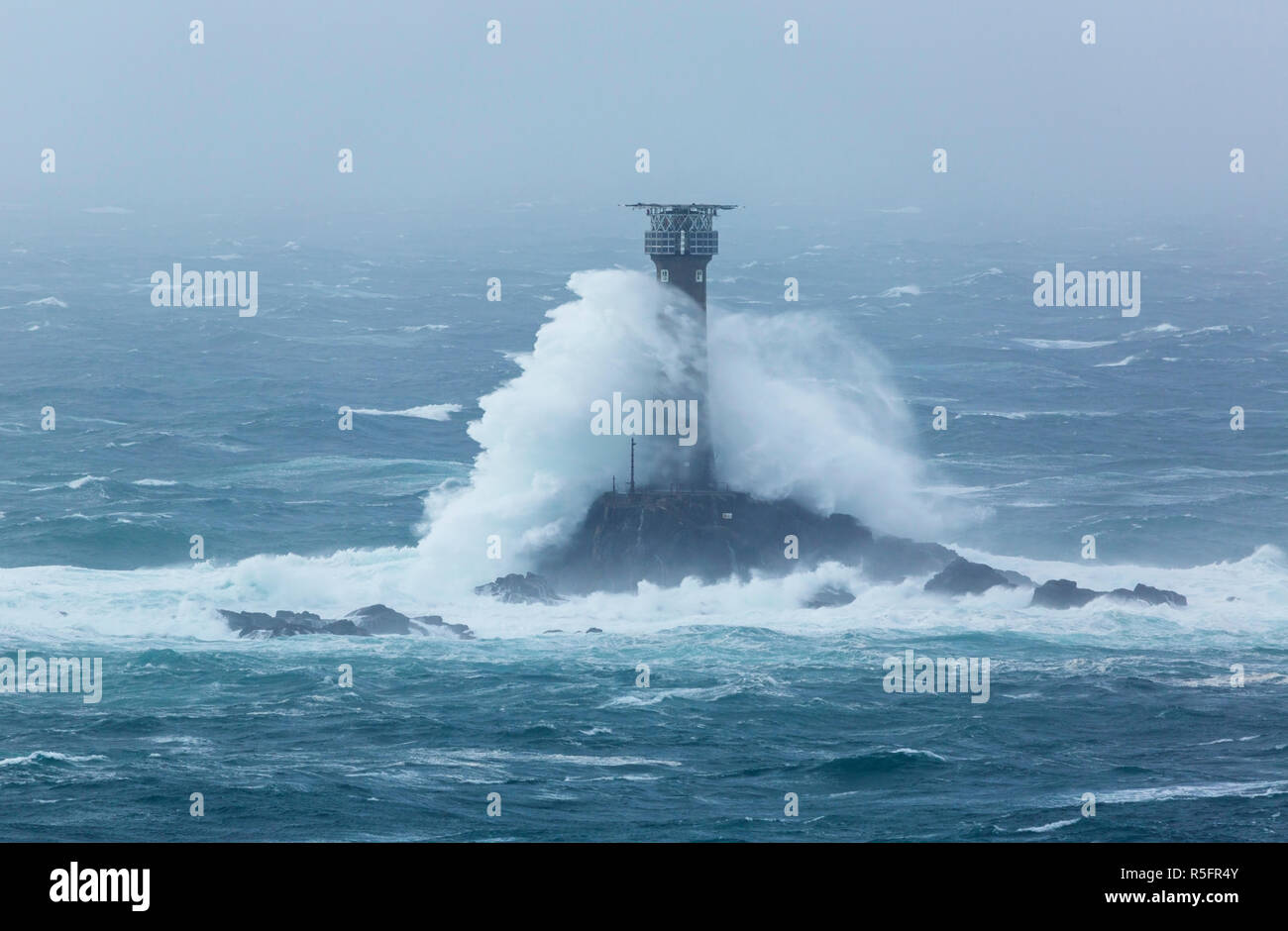 Storm Diana off the coast of Cornwall crashing into the Longships Lighthouse Stock Photo