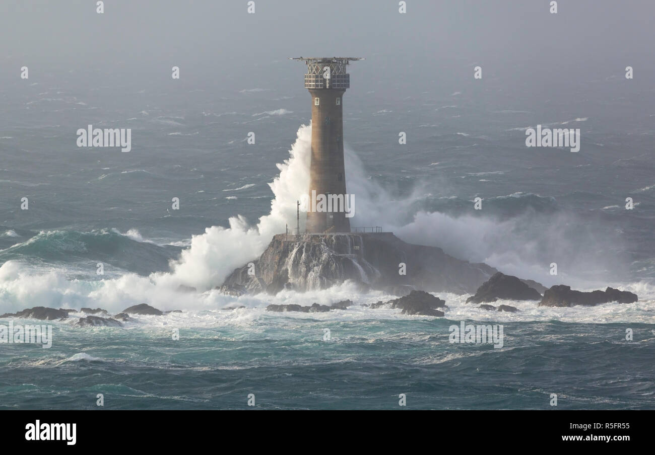 Storm Diana crashing into the Longships Lighthouse off Lands End Cornwall Stock Photo