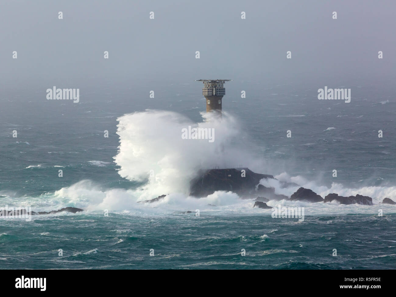 Storm Diana crashing into the Longships Lighthouse off Lands End Stock Photo