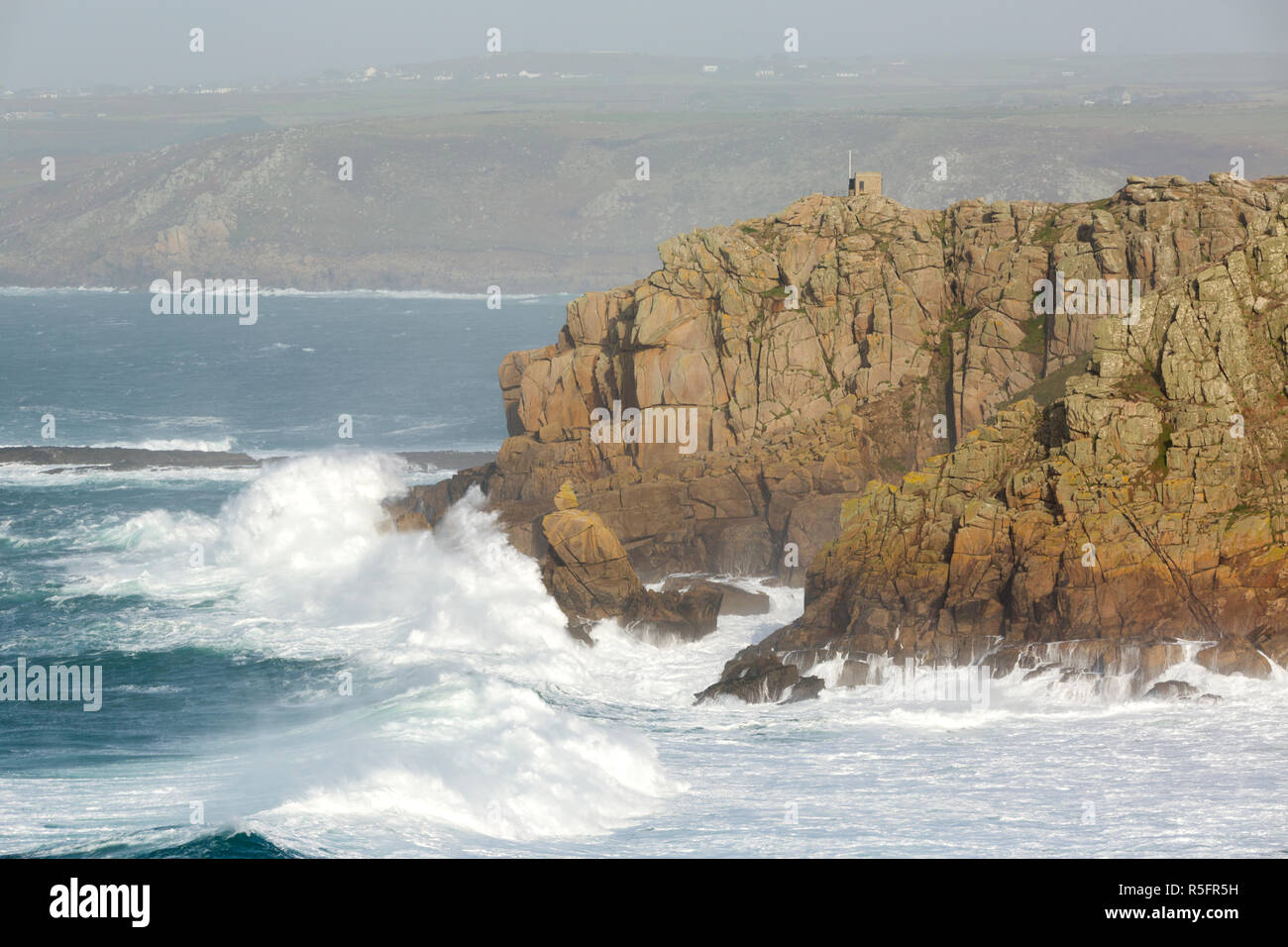 Crashing waves over Pedn Men Du near Sennen Cove in Cornwall Stock Photo