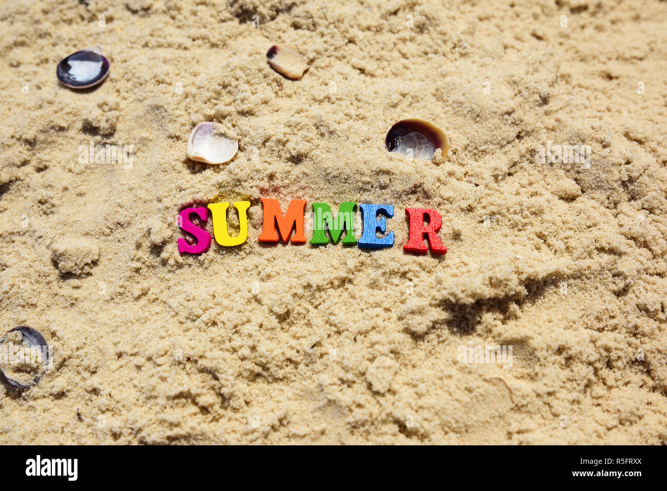 Inscription summer on sand with seashells Stock Photo