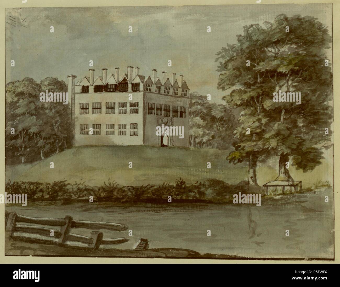 A fence and a body of water in the foreground; Fulford House set in