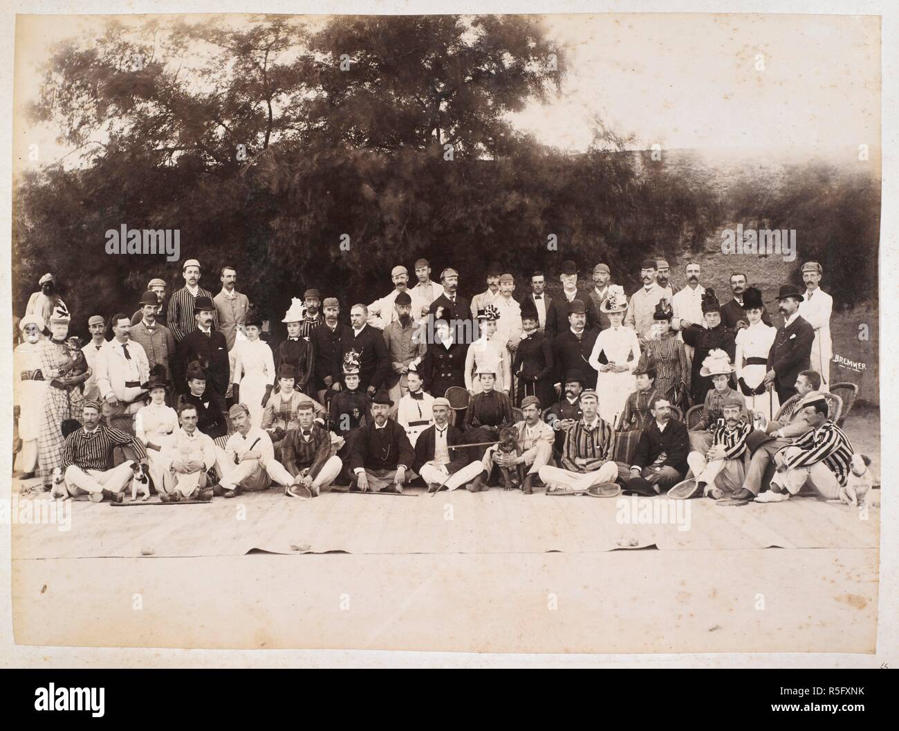 A European group, Hyderabad. This is most likely Hyderabad in Sindh, not the Deccan. Lieut-Colonel Reilly is sitting in a rattan chair right of centre . 1889. Photograph. Source: Photo 639/3(55). Author: Bremner, Frederick. Stock Photo